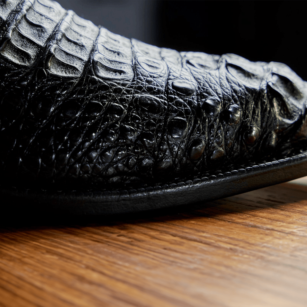 The toe of the Elio black caiman western boot. Shop the Elio.